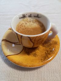 High angle view of coffee cup on table