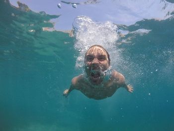 Portrait of man swimming in sea