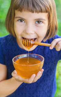 Close-up of girl eating food