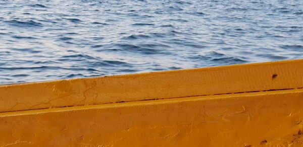 High angle view of yellow boat on sea