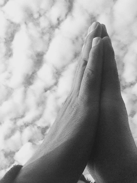 person, part of, cropped, low angle view, close-up, sky, one person, human finger, statue, day, outdoors, focus on foreground, sculpture, personal perspective, art and craft, holding, sunlight, unrecognizable person, cloud - sky