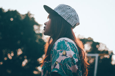 Portrait of young woman looking away