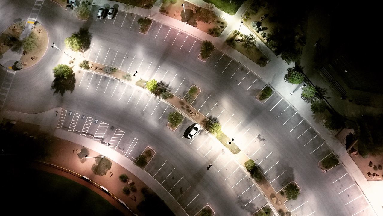 HIGH ANGLE VIEW OF CARS ON ROAD IN CITY