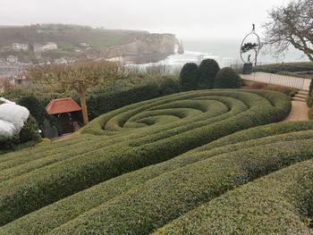 Scenic view of formal garden against sky