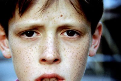 Close-up portrait of boy with freckles