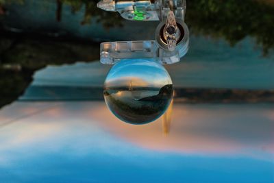 Close-up of bubbles in lake against sky