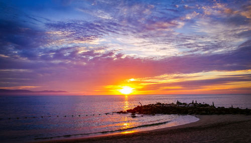 Scenic view of sea against sky during sunset