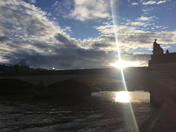 Scenic view of river at sunset
