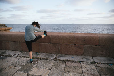 Woman stretching outside in spring