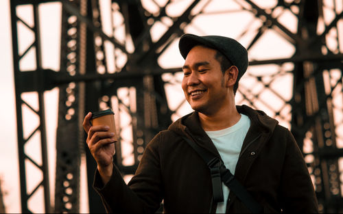 Portrait of young man using mobile phone