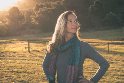 Beautiful woman standing on field