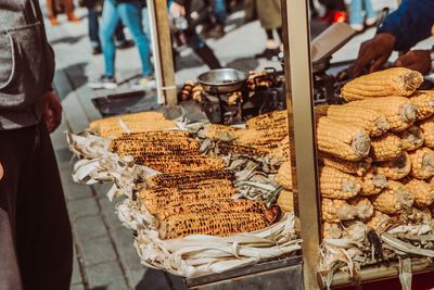 Midsection of person for sale at market stall