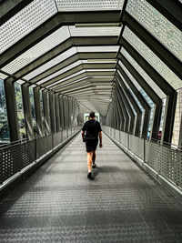 Rear view of man walking on street