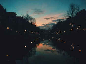 Reflection of illuminated buildings in water at night