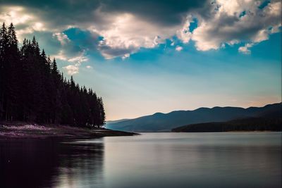 Scenic view of lake against sky during sunset