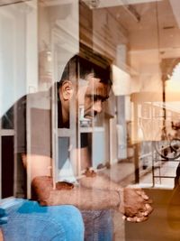 Multiple exposure of woman standing at home