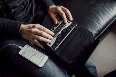 High angle view of man using mobile phone