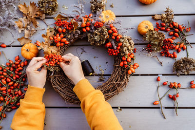 Low angle view of woman holding fruits