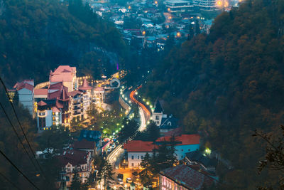 High angle view of illuminated buildings in city at night