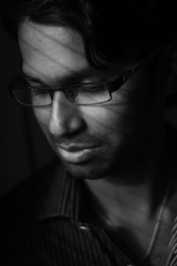 Close-up portrait of young man looking away
