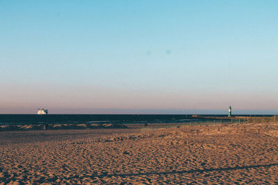 Scenic view of calm sea against blue sky