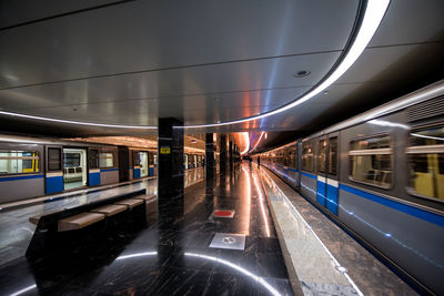 Trains at subway station during night