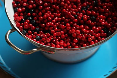 Close-up of lingonberries in container