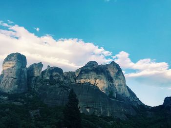 Low angle view of rock formation against sky