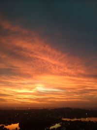 Scenic view of dramatic sky at sunset