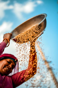 Portrait of a village woman doing daily chores