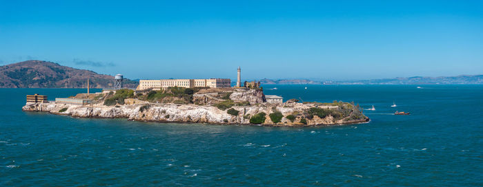 Scenic view of sea against clear blue sky