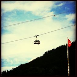 Low angle view of cables against sky