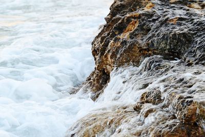 Sea waves splashing on rocks