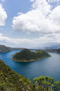 High angle view of sea and mountains against sky