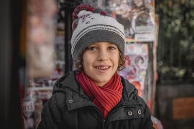 Portrait of smiling boy in park during winter