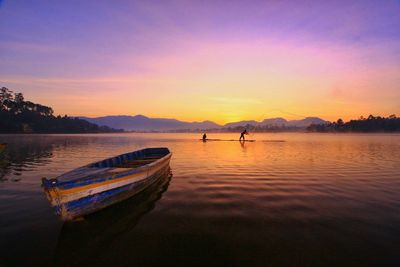 Scenic view of lake against sky during sunset