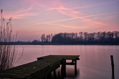 Scenic view of lake against sky during sunset