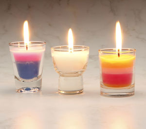 Close-up of lit tea candles on table
