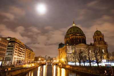 Illuminated buildings in city at night