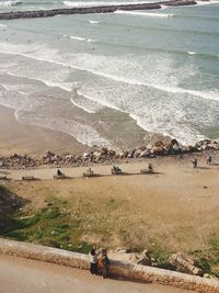 People on beach by sea