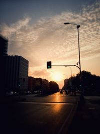 View of city street at sunset