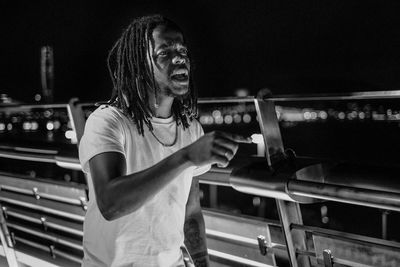 Smiling young man with dreadlocks