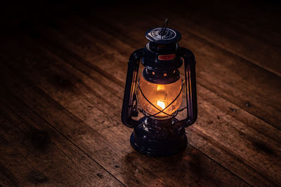 High angle view of illuminated lamp on table