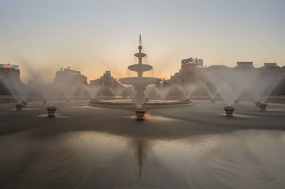 View of fountain in city during winter