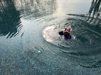 High angle view of boy swimming in pool