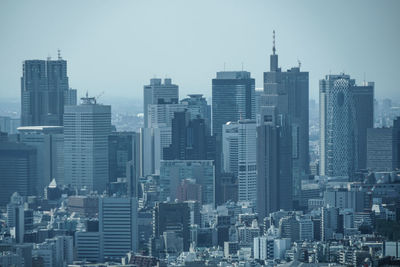 Skyscrapers in city against clear sky