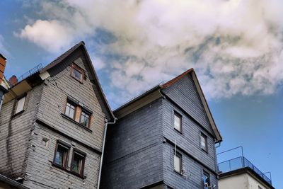 Low angle view of building against cloudy sky