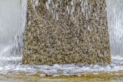 Close-up of sea waves splashing on wall