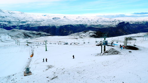 Scenic view of landscape against sky during winter