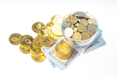 High angle view of coins on white background